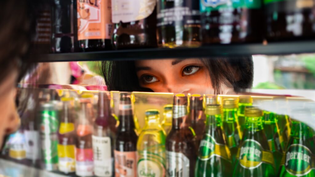 Looking as a shelf of bottles