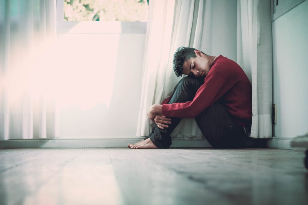 Boy sitting by the window