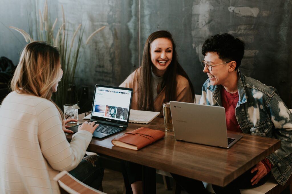 Three people laughing 