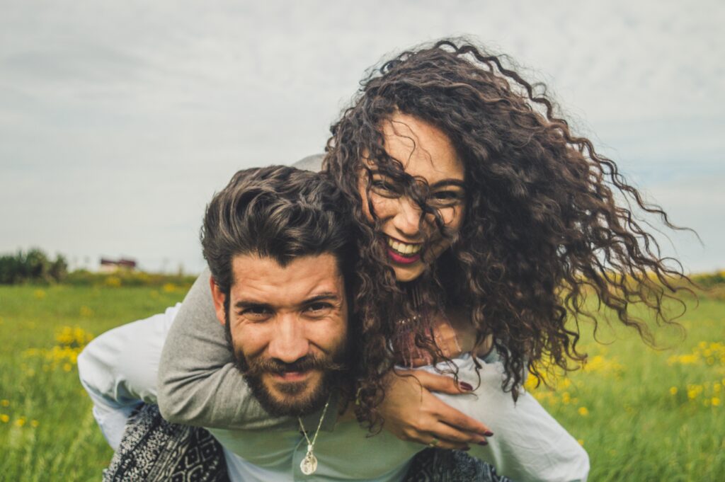 Man carry lady on his back