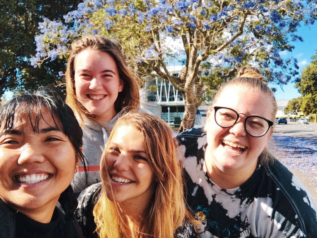 Girls taking group selfie