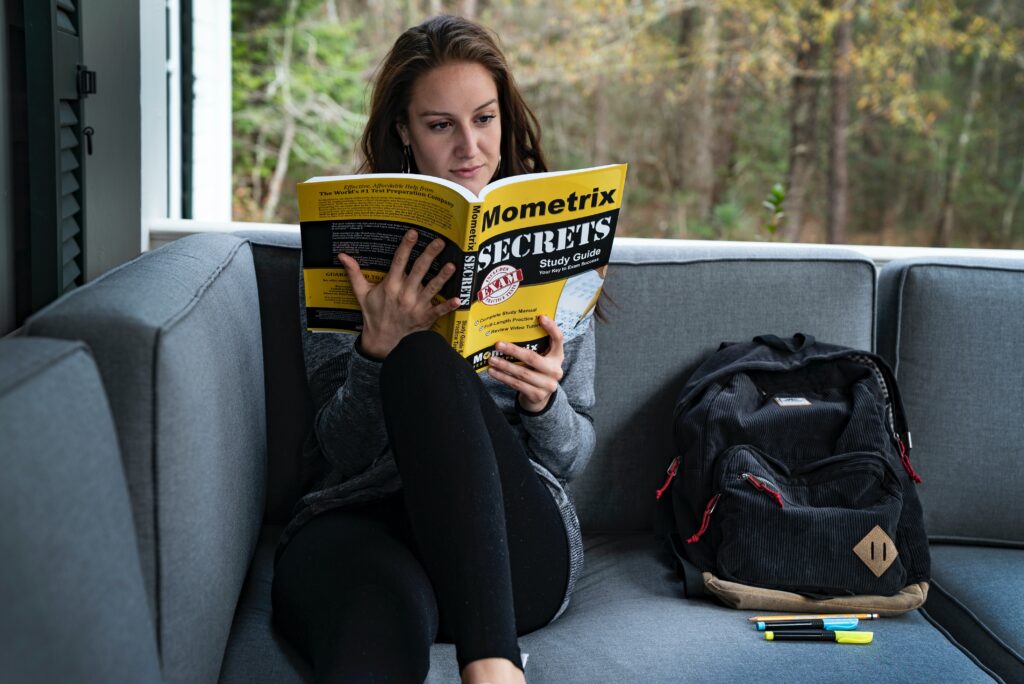 Woman reading a big book