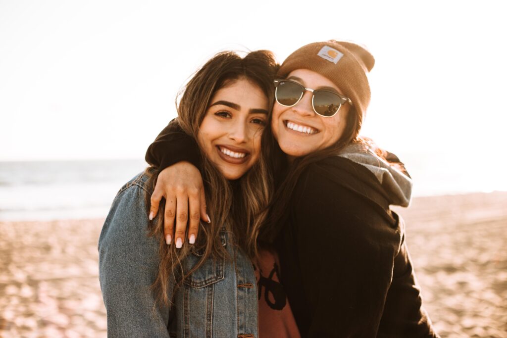 Two girls hugging and smiling