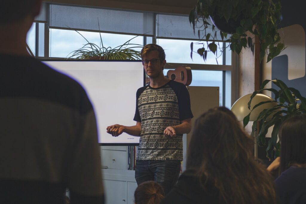 Man standing and talking to group